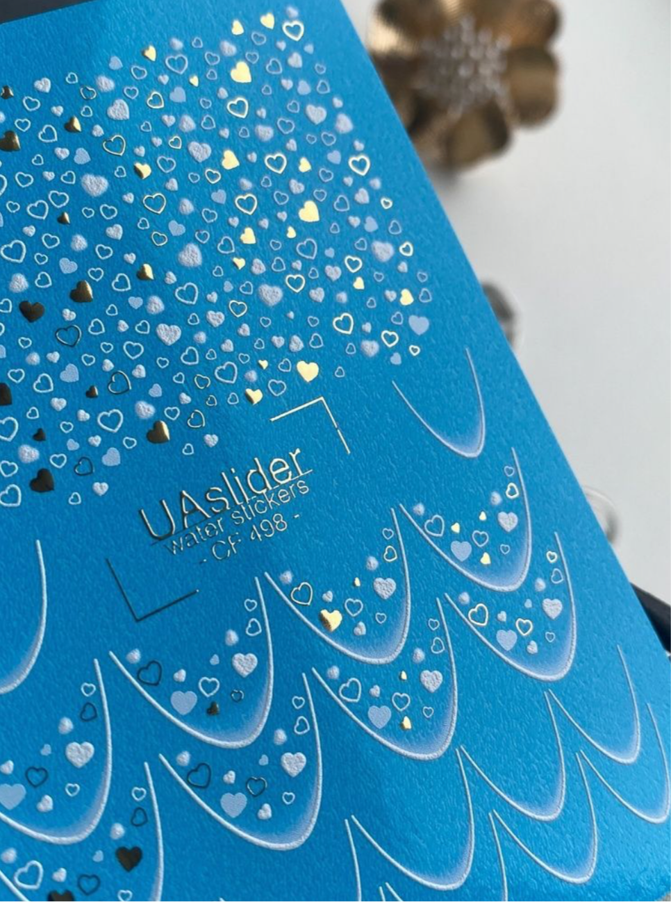 UA Slider CF 498 – Blaue Herzen & Folien-Glanz