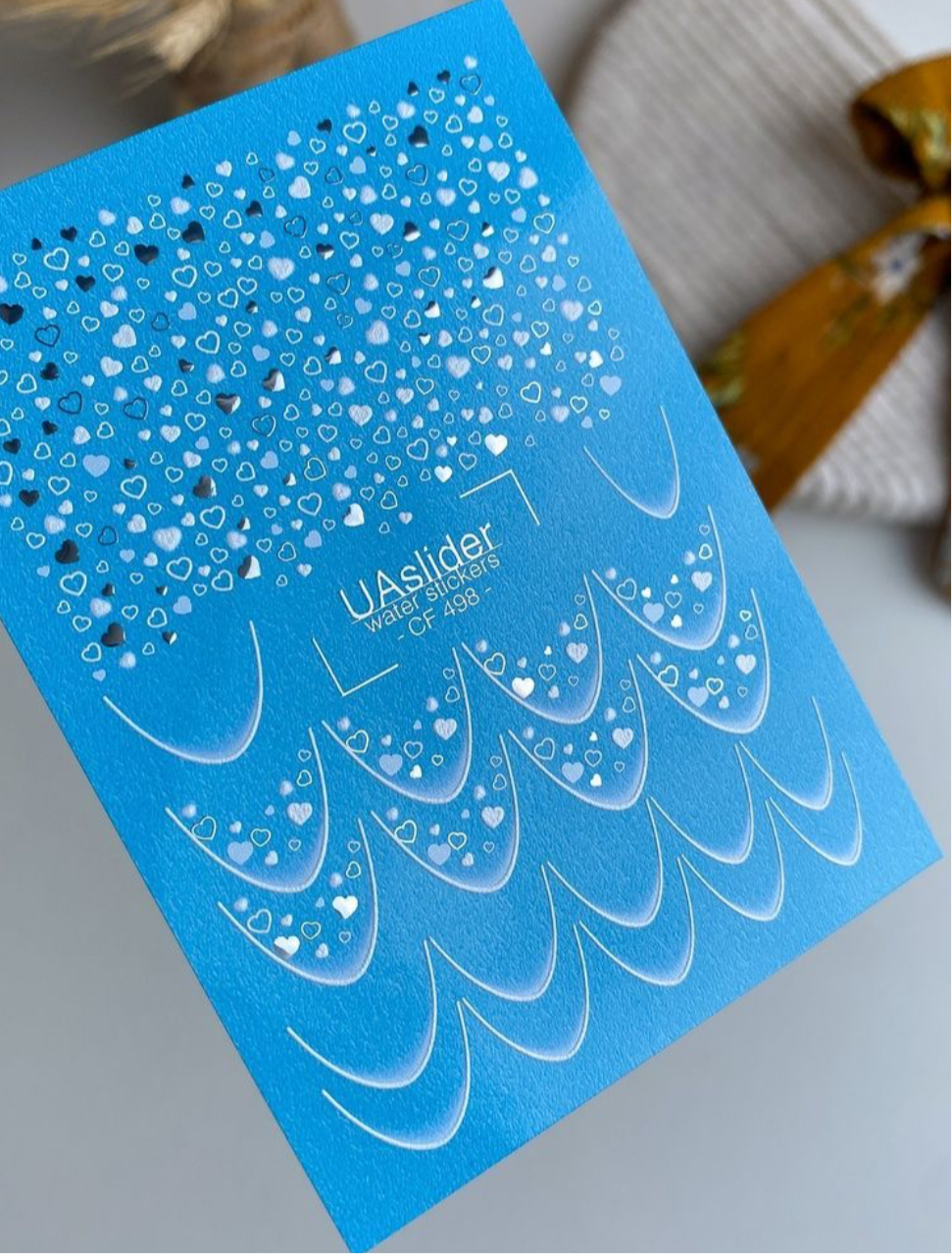 UA Slider CF 498 – Blaue Herzen & Folien-Glanz