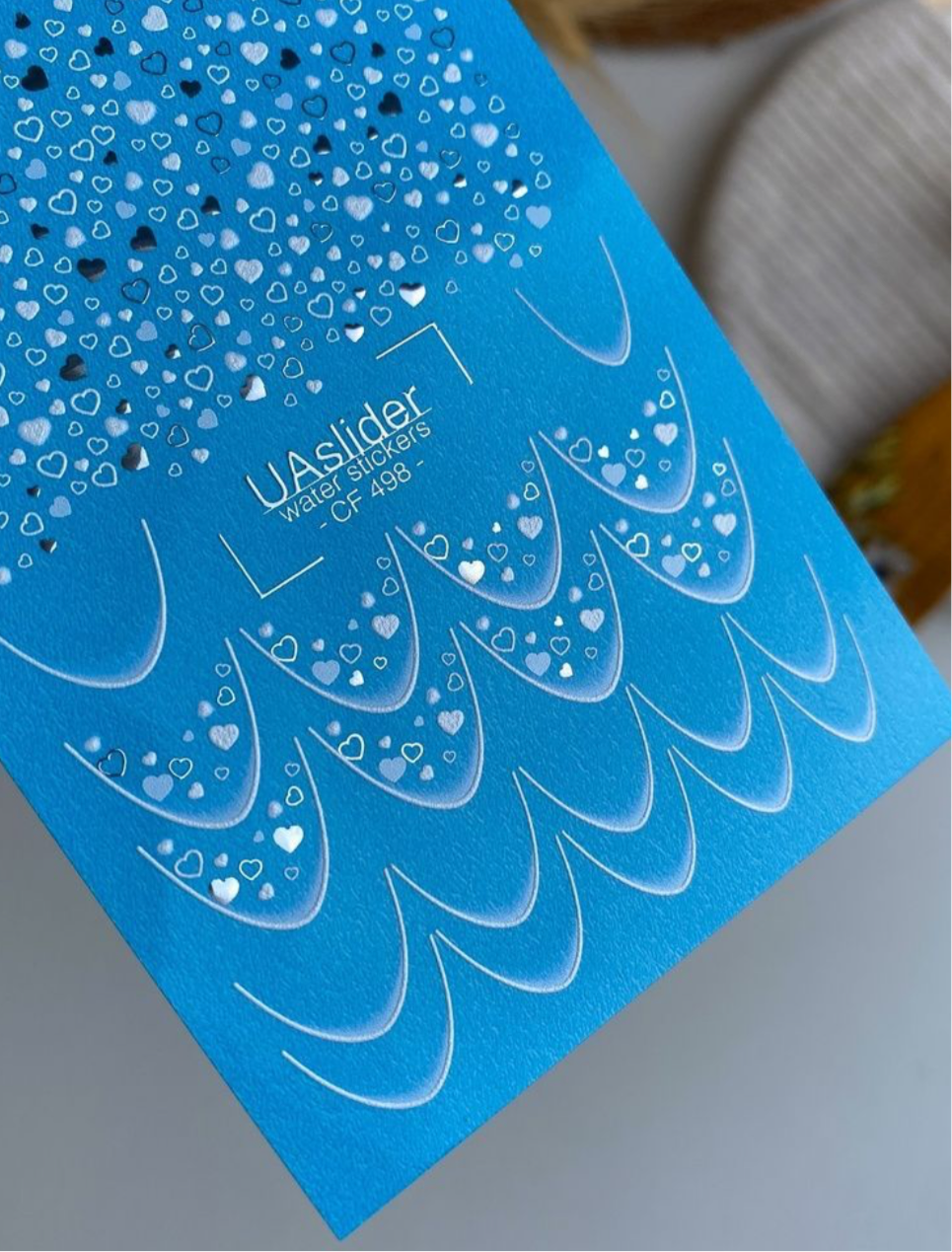 UA Slider CF 498 – Blaue Herzen & Folien-Glanz