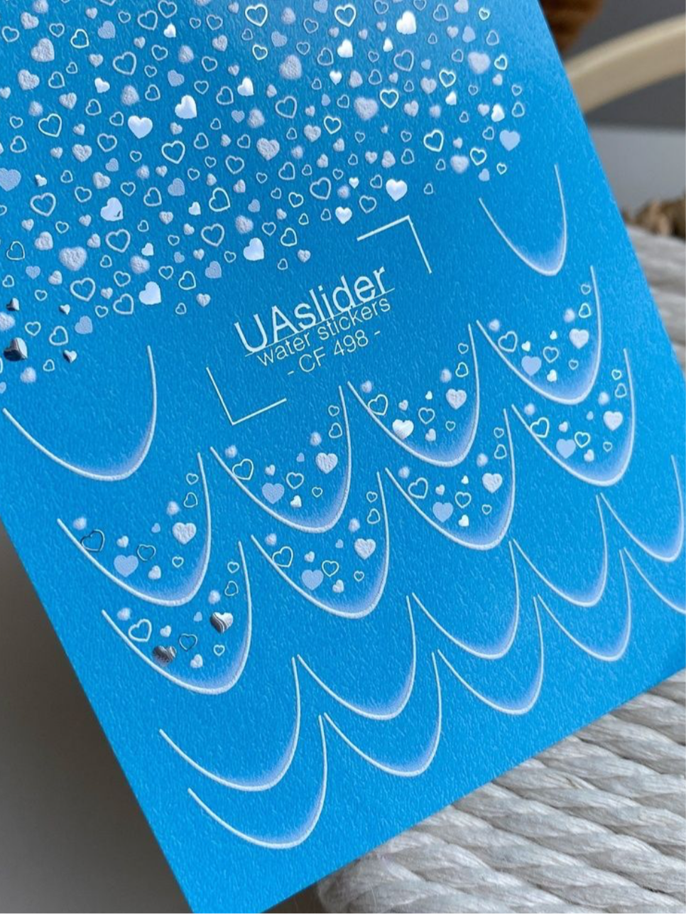 UA Slider CF 498 – Blaue Herzen & Folien-Glanz