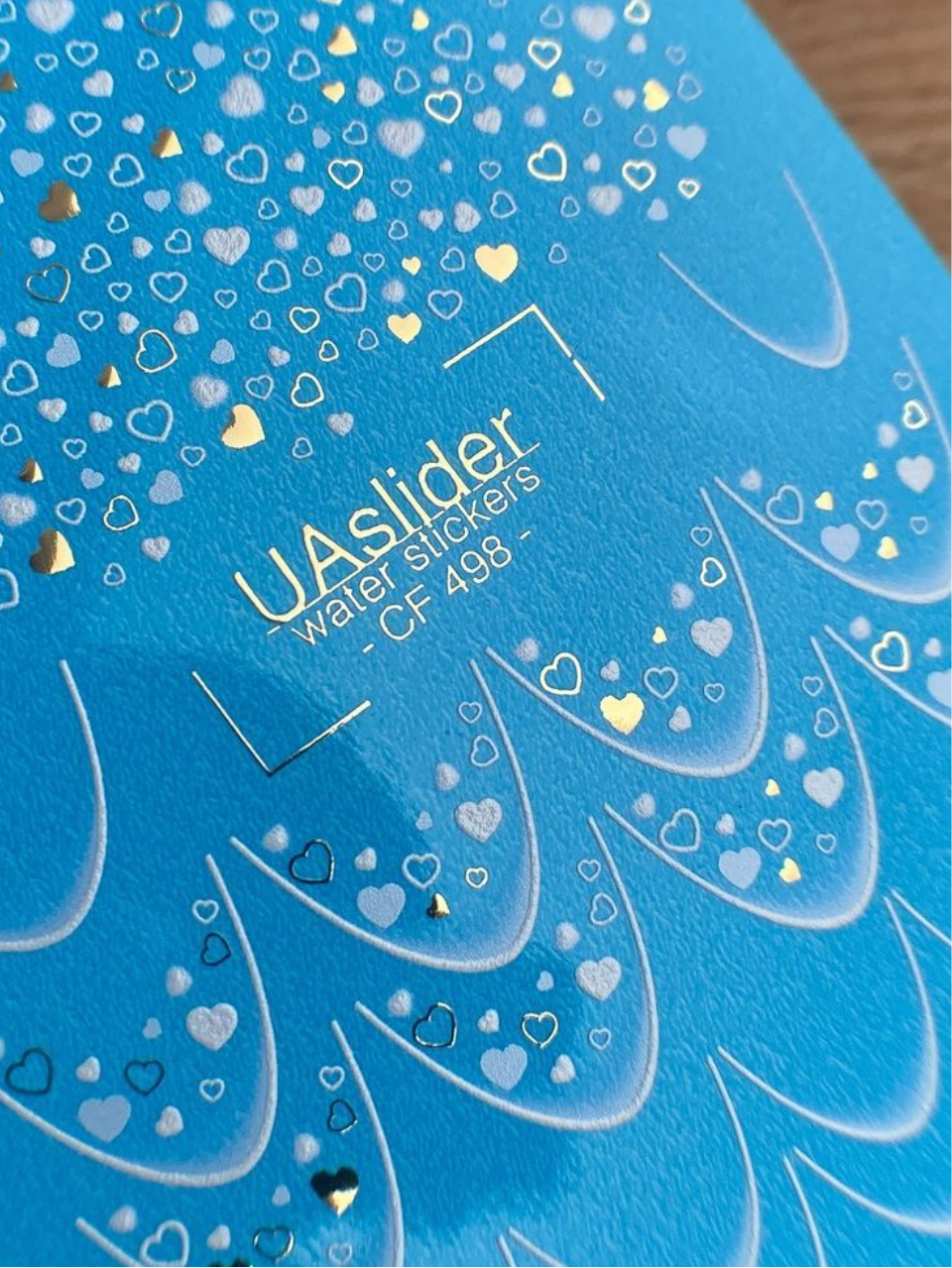 UA Slider CF 498 – Blaue Herzen & Folien-Glanz